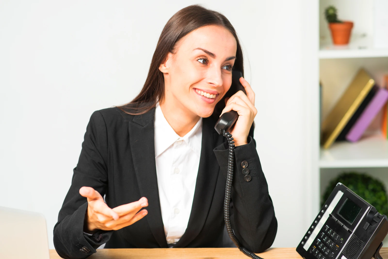 happy-young-woman-sitting-office